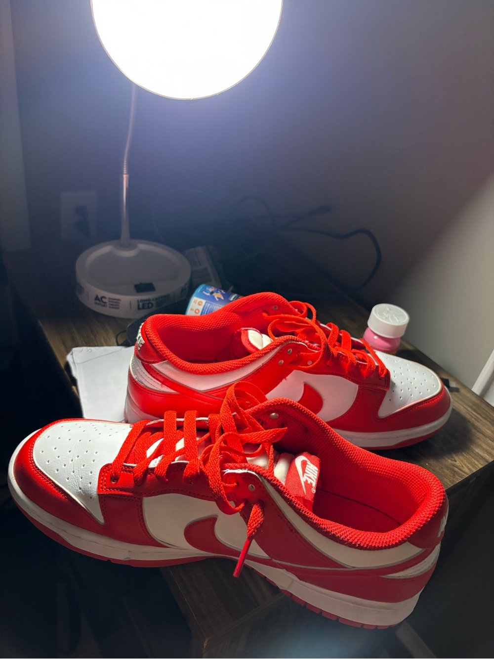 Nike Red and White Low-Top Sneakers with Bold Swoosh